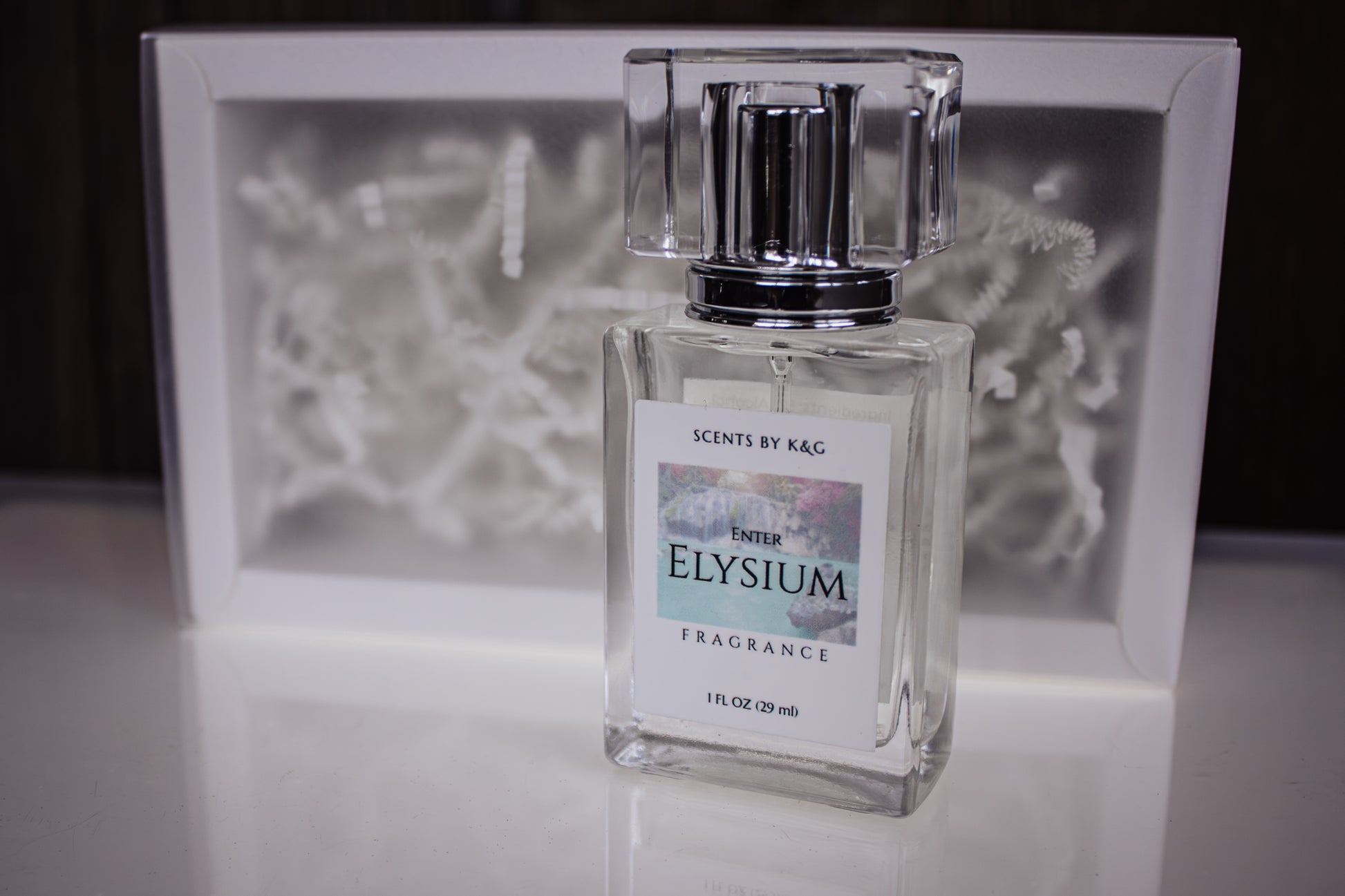 Enter Elysium Fragrance bottle with packaging box in the background